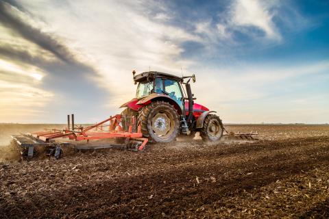 Tractor cultivating field