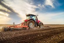 Tractor cultivating field